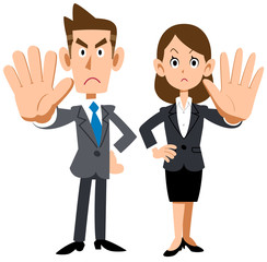 拒否のポーズをする若い会社員の男女
