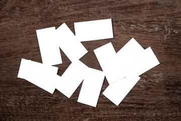 Blank portrait mock-up paper. brochure magazine isolated on brown wooden table, changeable background / white paper isolated on wood