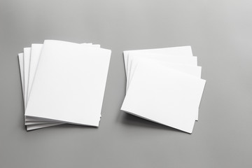 Blank portrait mock-up paper. brochure magazine isolated on gray, changeable background / white paper isolated on gray