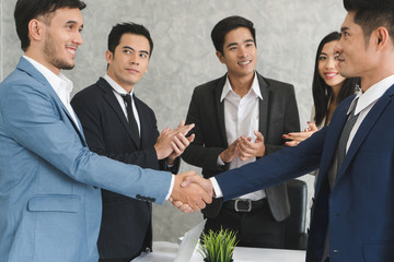 Business team partners meeting and discussing in workplace.