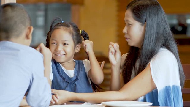 Asian family, mother, son and daughter play happily.
