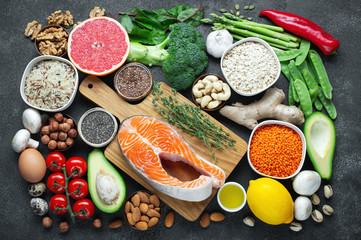 Healthy food clean eating selection: fish, fruit, nuts, vegetable, seeds, superfood, cereals, leaf...