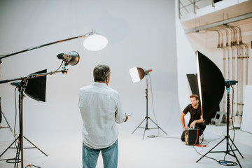 Artist in the studio with lighting equipment