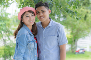 Asian couple on nature background.