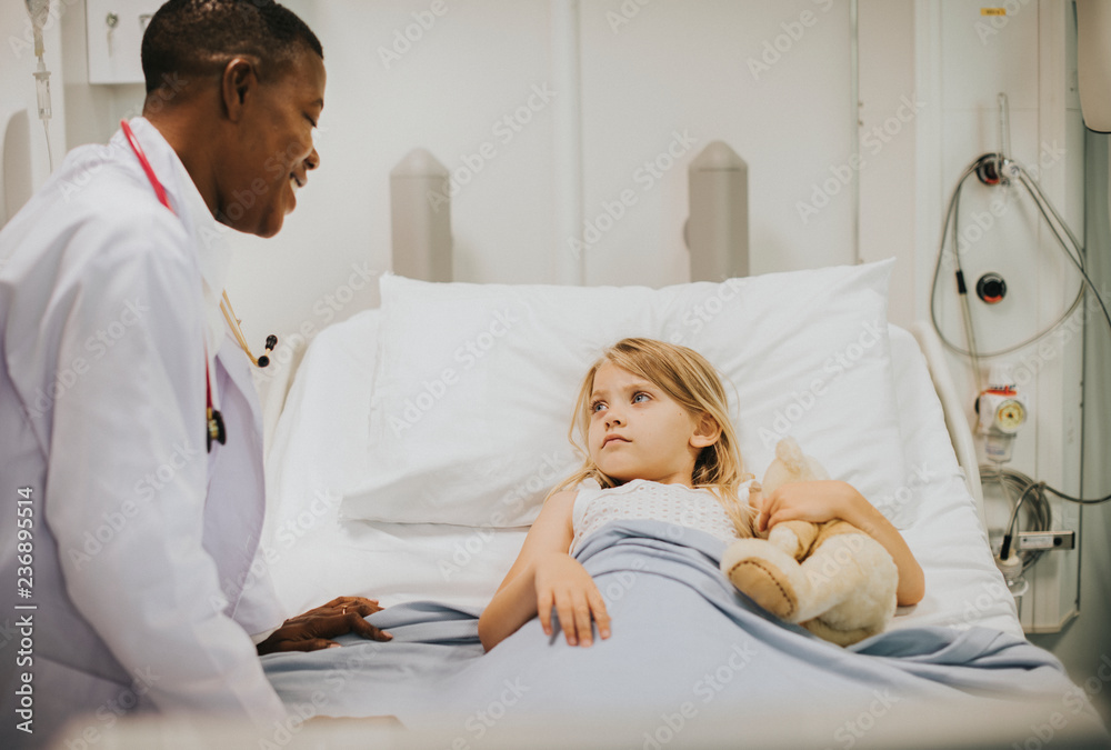 Canvas Prints Children's pediatrician smiling at her patient