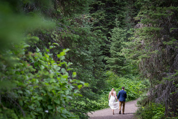 couple walking through forest