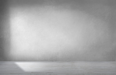 Gray wall in an empty room with concrete floor