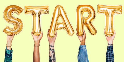 Hands holding start word balloon