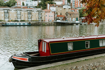Boathouse in the water with a view of the village