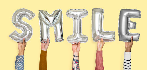 Hands showing smile balloons word