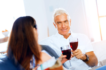 Portrait of a couple having a glass of red wine