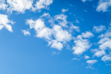 blue sky with white light clouds