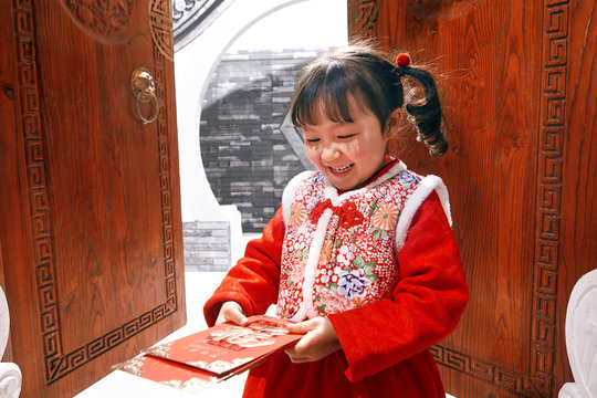 Cute girl with a red envelope