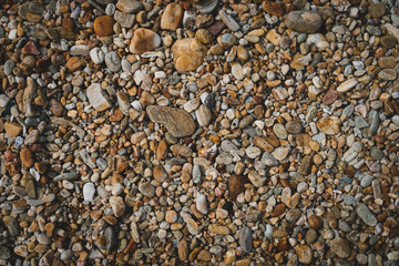 Many small stone brown color tone background.