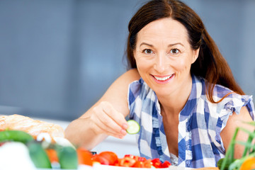 Beautiful woman standing in the kitchen