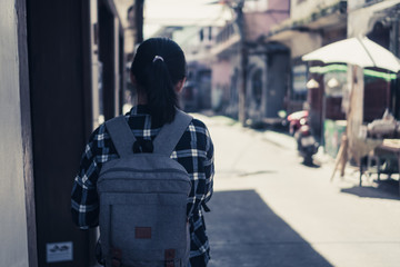 Woman travel around the world with backpack.