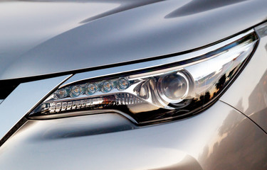 Car's exterior details. Close up detail LED headlights on a modern car.