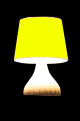 Table lamp with soft light on a black background
