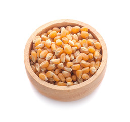 Dried yellow corn kernels on white background