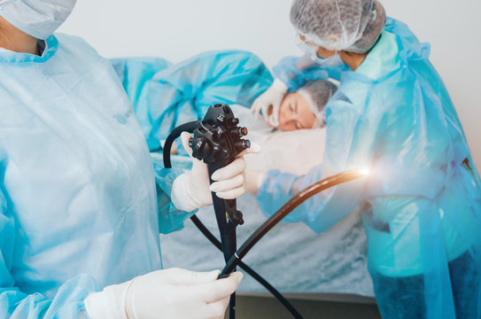 Endoscopy at the hospital. Doctor holding endoscope before gastroscopy