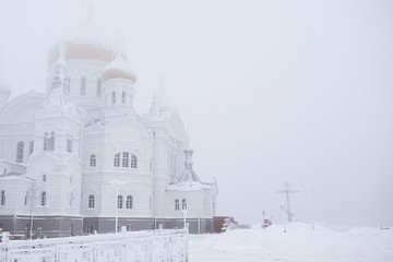 Orthodox church in winter, Russian Federation. Belogorsky Monastery. White background. 