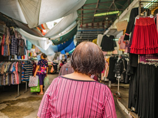 Back of Senior asian women walking and shopping on 