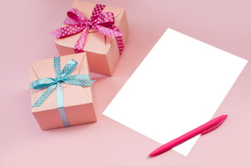 Decorated boxes and blank white sheet of paper.