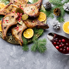 Christmas dinner with roasted meat steak, Christmas Wreath salad, baked potato, grilled vegetables, cranberry sauce.