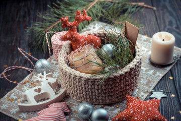 Christmas balls for tree in wicker red basket