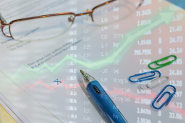 Stock market capital gains and money earned from investing.  Upswing concept with money in hand for USD rising and financial firms earning millions.