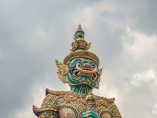 Fototapeta na wymiar Giant The front of gate with Cloud sky in Wat phrakaew Temple Bangkok city thialand