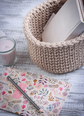 Knitted baskets of cord on white background