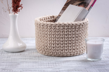 Knitted baskets of cord on white background