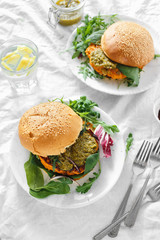 Vegetarian burger pumpkin cutlet spinach arugula pesto top view Healthy food