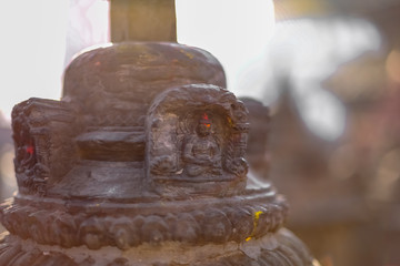 Small statue of Buddha carved in the stone