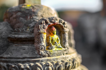 Small statue of Buddha carved in the stone
