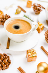 cup of hot coffee on a christmas holiday table. holidays and events consept.