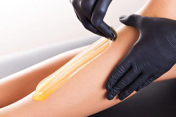 Hair removal process on female leg with epilation