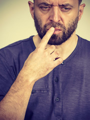 Confused focused serious man thinking