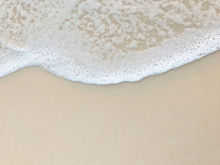 Sea Foam on Beach Sand