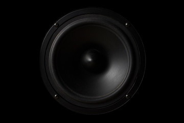 Black Music speaker on a black isolated background. Party or music listening concept