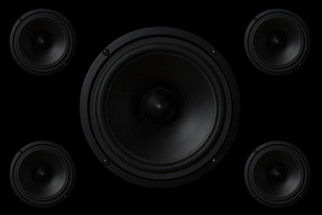 Black Music speaker on a black isolated background. Party or music listening concept