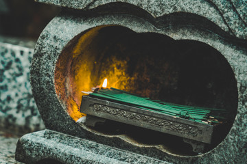 incense burning at japanese grave