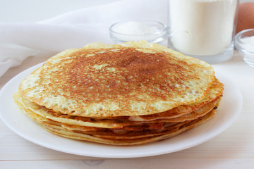 Russian pancakes on a white plate