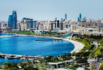 Scenic landscape of skyline Baku with  numerous modern high-rise buildings under construction - obrazy, fototapety, plakaty
