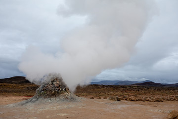 Geothermal fields Iceland Europe. Geysers and fumaroles emit white cloud of steam