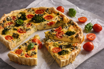 Homemade tart with broccoli, tomatoes and blue cheese.