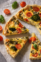 Homemade tart with broccoli, tomatoes and blue cheese.