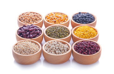Cereal grains , seeds, beans on wooden background