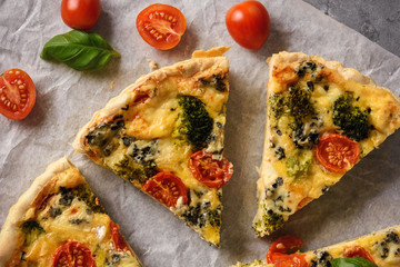 Homemade tart with broccoli, tomatoes and blue cheese.